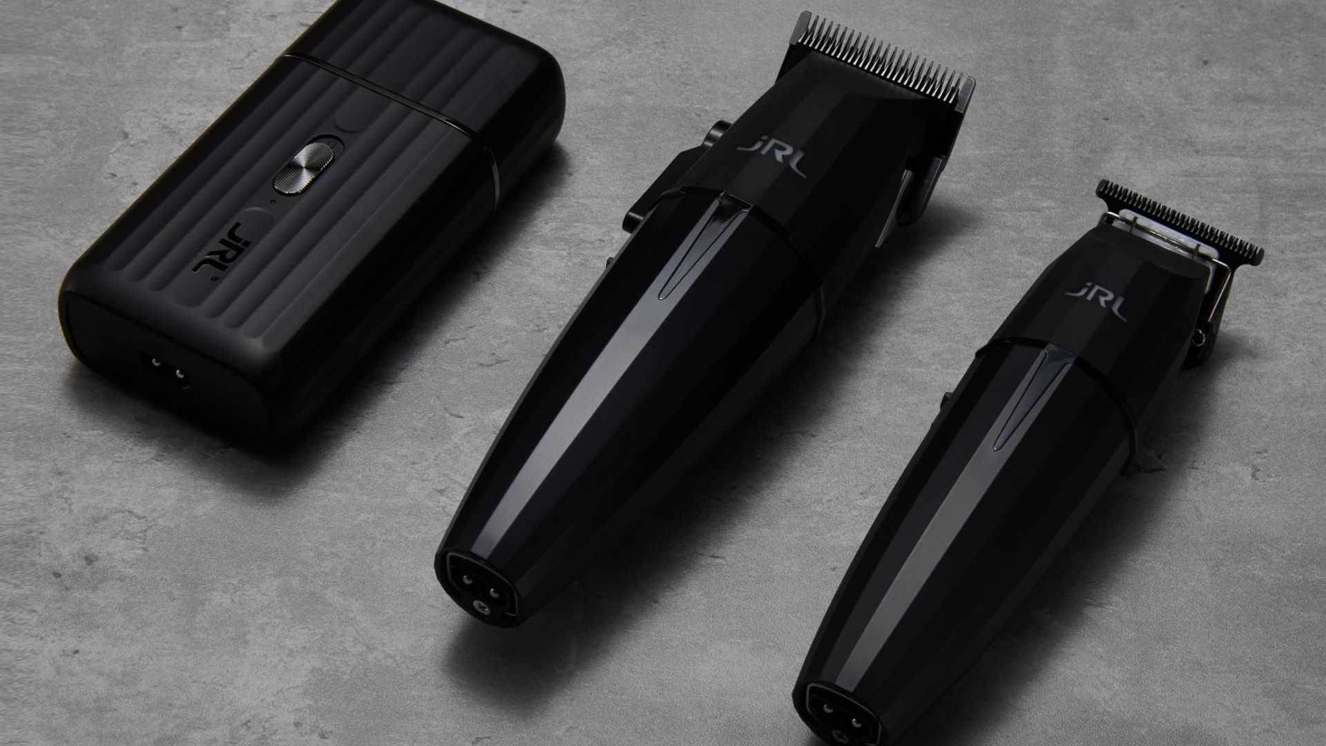 Set di strumenti professionali JRL Professional, composto da tagliacapelli, rifinitore e rasoio elettrico in elegante design nero opaco.