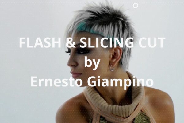 Primo piano di una modella con taglio corto e creativo, tecnica Flash & Slicing Cut di Ernesto Giampino, su sfondo chiaro.