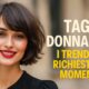 Donna con caschetto mosso e frangia leggera, esempio di taglio di tendenza 2025.