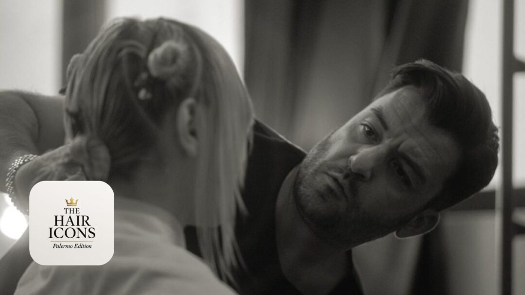 Toni Pellegrino, hairstylist e Direttore Artistico di THE HAIR ICONS Palermo Edition 2025, mentre realizza un’acconciatura professionale.