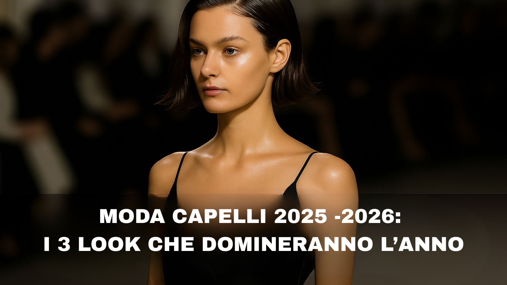Modella in passerella con taglio Fluid Bob e finish lucido, ispirazione moda capelli 2025–2026, illuminata da luci da sfilata.