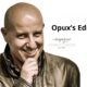 Smiling bald man in a leather jacket, hand on chin, on a white background with the headline “Opux’s Editorial” and the faint “Il Magazine del Parrucchiere (since 2001)” logo.