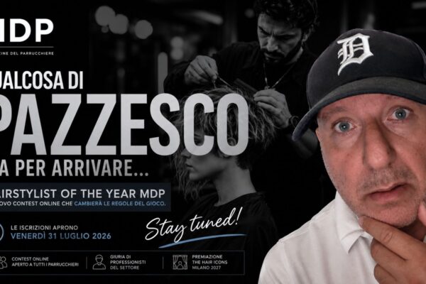 Anteprima del contest Hairstylist of the Year MDP con Alberto Montecroci in primo piano e la scritta "Qualcosa di pazzesco sta per arrivare". Sullo sfondo un hairstylist al lavoro e la data di apertura delle iscrizioni: 31 luglio 2026.