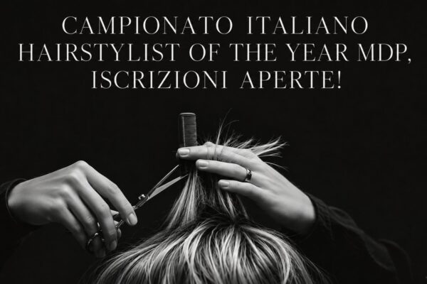 Mani di un hairstylist al lavoro durante una sessione di styling, fotografia editoriale in bianco e nero ad alto contrasto