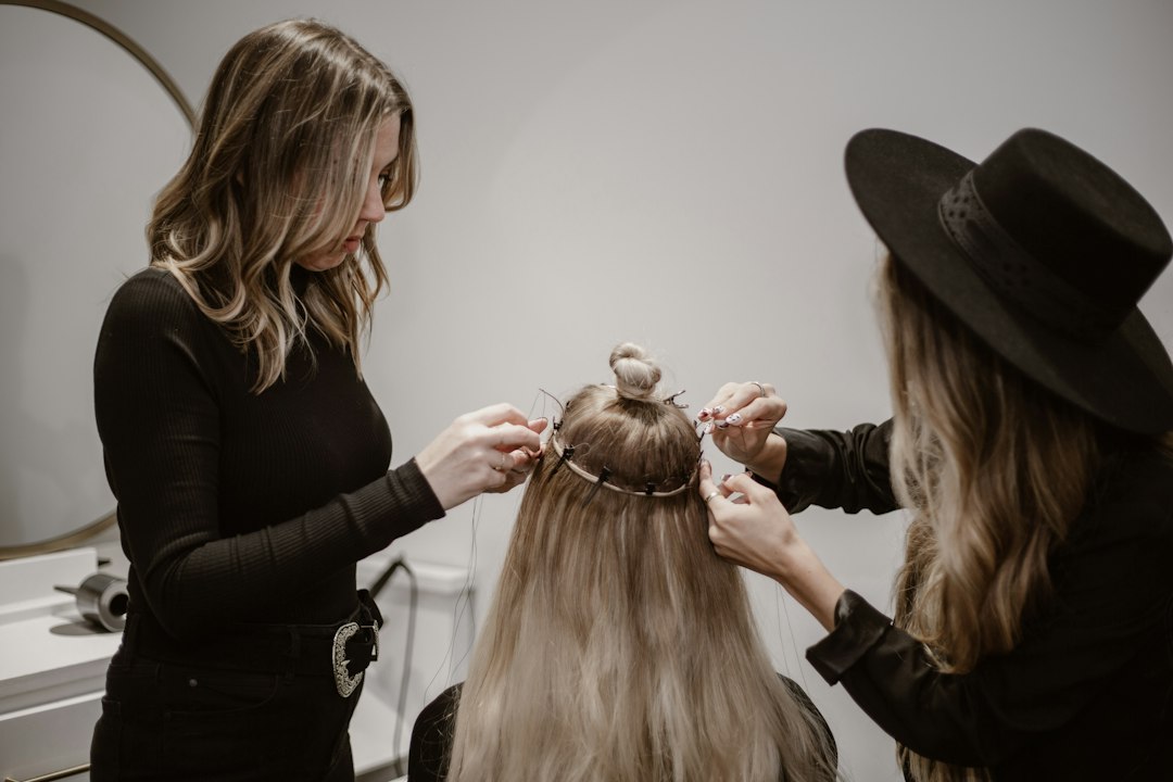 Hairstylist working with a client in a professional salon