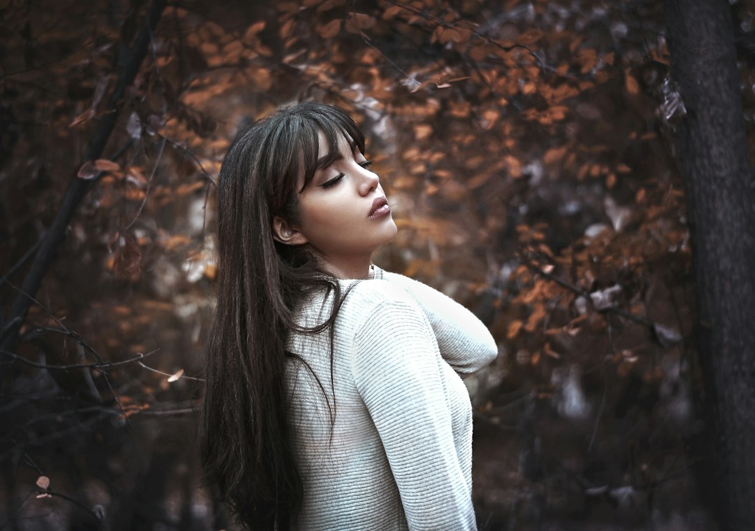 Woman with soft long fringe in an autumn setting