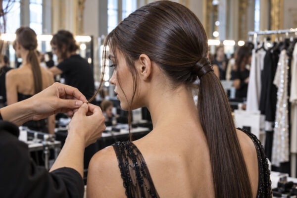 Backstage at Milan Fashion Week SS27: very low ponytail with loose face-framing pieces