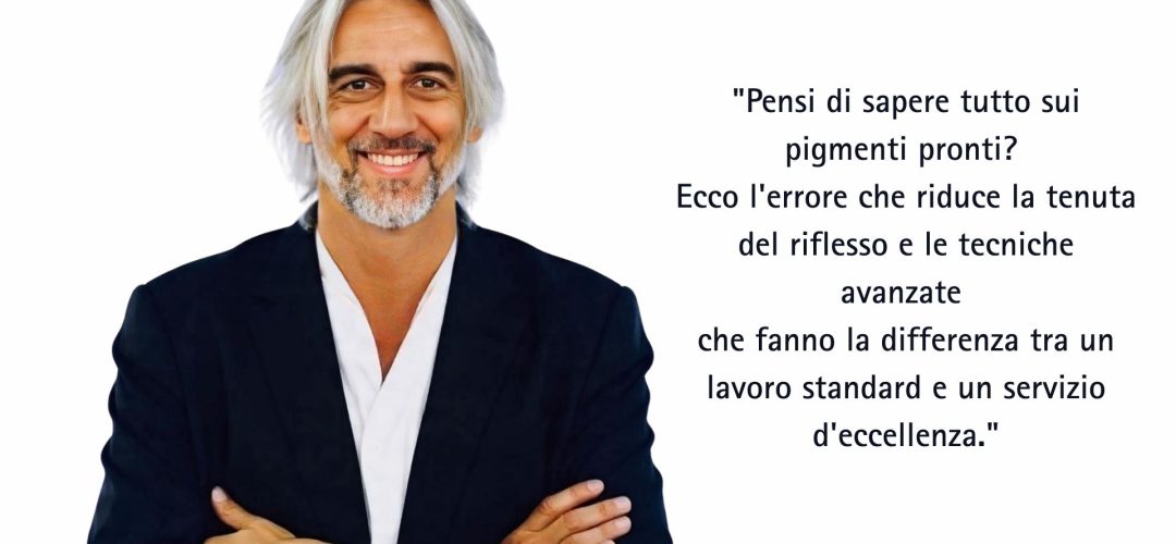 Paolo Venzo a braccia conserte accanto alla citazione sui pigmenti pronti e le tecniche avanzate di colorazione diretta per parrucchieri.