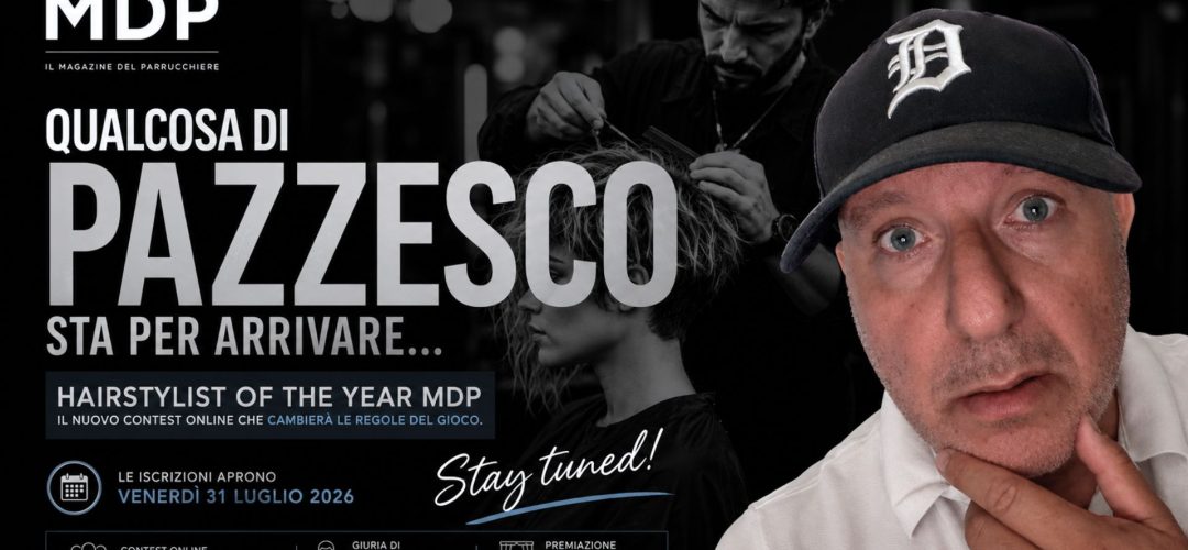 Anteprima del contest Hairstylist of the Year MDP con Alberto Montecroci in primo piano e la scritta "Qualcosa di pazzesco sta per arrivare". Sullo sfondo un hairstylist al lavoro e la data di apertura delle iscrizioni: 31 luglio 2026.